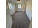 Cozy bedroom with plush carpeting, bright windows, and ample closet space, creating a comfortable and private retreat at 253 7Th St, Frederick, CO 80530
