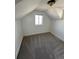 Bedroom featuring neutral carpet, white walls, and natural light from a window at 253 7Th St, Frederick, CO 80530