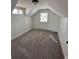 Cozy bedroom featuring neutral carpet, white walls, and natural light from two windows at 253 7Th St, Frederick, CO 80530