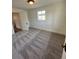 Comfortable bedroom featuring soft carpeting, a bright window, and ample space, perfect for relaxation and rest at 253 7Th St, Frederick, CO 80530