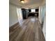 Updated kitchen featuring dark cabinets, stainless steel appliances, and sleek flooring, combining style and functionality at 253 7Th St, Frederick, CO 80530