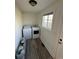Convenient laundry room with modern washer and dryer, offering efficiency and functionality for household chores at 253 7Th St, Frederick, CO 80530