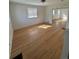 Bright and airy living room with gleaming hardwood floors and ample natural light, creating a welcoming space at 253 7Th St, Frederick, CO 80530