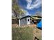 Exterior view of grey backyard shed with a single door and window at 253 7Th St, Frederick, CO 80530