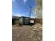 Exterior view of grey backyard shed with a single door and window at 253 7Th St, Frederick, CO 80530