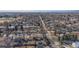 Aerial view of house and neighborhood, city skyline in distance at 7195 W 24Th Ave, Lakewood, CO 80214