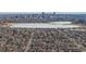 Frozen lake and city skyline in background, neighborhood view at 7195 W 24Th Ave, Lakewood, CO 80214