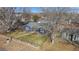 Nice blue house with a yard, trees, and walkway at 7195 W 24Th Ave, Lakewood, CO 80214