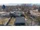 Backyard view showing patio, detached garage, and surrounding homes at 7195 W 24Th Ave, Lakewood, CO 80214