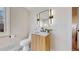 Modern bathroom with stylish vanity, updated fixtures, and a contemporary mirror at 7195 W 24Th Ave, Lakewood, CO 80214