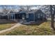 Rear view of house with patio and landscaping at 7195 W 24Th Ave, Lakewood, CO 80214