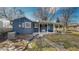 Rear view of house with patio and landscaping at 7195 W 24Th Ave, Lakewood, CO 80214