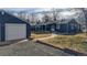 House exterior showcasing the garage and backyard at 7195 W 24Th Ave, Lakewood, CO 80214