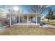 Rear view of house with covered patio and landscaping at 7195 W 24Th Ave, Lakewood, CO 80214