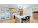 Open and bright kitchen, featuring updated appliances and a center island at 7195 W 24Th Ave, Lakewood, CO 80214