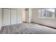 Bedroom with neutral carpet, natural light, and large closet with multiple doors at 1251 S Yosemite Way # 92, Denver, CO 80247