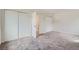 Bedroom featuring neutral walls, carpet, and closet with modern doors at 1251 S Yosemite Way # 92, Denver, CO 80247
