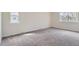 Bright bedroom featuring plush carpet, ample natural light from two windows at 1251 S Yosemite Way # 92, Denver, CO 80247