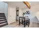 Open dining area features a modern table, seating, and access to the in-unit washer and dryer at 1251 S Yosemite Way # 92, Denver, CO 80247