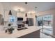 Modern kitchen with stainless steel appliances, white cabinets, and a large island at 1251 S Yosemite Way # 92, Denver, CO 80247