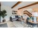 Bright living room showcasing stylish furniture, hardwood floors, and a staircase at 1251 S Yosemite Way # 92, Denver, CO 80247