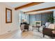 Charming living room featuring hardwood floors, brick fireplace, and comfortable seating at 1251 S Yosemite Way # 92, Denver, CO 80247