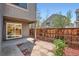 Private back patio provides outdoor space with wood fencing and mature landscaping at 1251 S Yosemite Way # 92, Denver, CO 80247