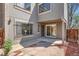 Private front patio offers an outdoor living space with stone tile and sliding door at 1251 S Yosemite Way # 92, Denver, CO 80247