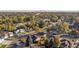 An aerial view showcasing the home nestled in a quiet residential neighborhood with mature trees at 709 S Wolcott Ct, Denver, CO 80219
