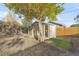 Backyard shed converted to office with doors open at 709 S Wolcott Ct, Denver, CO 80219