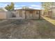 Back of the house showing the covered patio and shed at 709 S Wolcott Ct, Denver, CO 80219