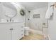 Updated bathroom features a modern vanity and tiled shower at 709 S Wolcott Ct, Denver, CO 80219