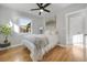 Bedroom with hardwood floors, a window and stylish decor create a relaxing atmosphere at 709 S Wolcott Ct, Denver, CO 80219