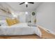 Cozy bedroom with a stylish barn door and comfortable decor at 709 S Wolcott Ct, Denver, CO 80219