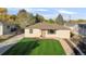 Charming single-story home with a well-manicured lawn and classic design at 709 S Wolcott Ct, Denver, CO 80219