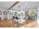 Bright kitchen with island, stainless steel appliances, and hardwood floors at 709 S Wolcott Ct, Denver, CO 80219