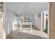 Bright, naturally lit office featuring a large window, neutral walls and wood grain floors at 709 S Wolcott Ct, Denver, CO 80219
