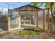 Backyard shed converted to office with doors open at 709 S Wolcott Ct, Denver, CO 80219