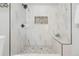Bathroom featuring a tiled shower with a rainfall showerhead at 709 S Wolcott Ct, Denver, CO 80219