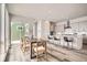 Open-concept design featuring dining area connected to modern kitchen and an adjacent outdoor patio at 959 Promenade Dr, Superior, CO 80027