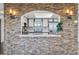 Cozy kitchen view from the living room, accented by a stone wall at 14152 E Linvale Pl # 605, Aurora, CO 80014