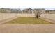 A well-maintained backyard features lush lawn, a patio area, and a privacy fence at 4574 Walden St, Denver, CO 80249