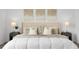 Tastefully decorated bedroom featuring calming wall art, plush pillows, and stylish bedside tables with lamps at 4574 Walden St, Denver, CO 80249