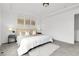 Bright primary bedroom featuring a neutral color palette, a queen-size bed and plush carpet at 4574 Walden St, Denver, CO 80249