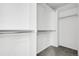 White walk-in closet features built-in shelves and chrome rods at 4574 Walden St, Denver, CO 80249