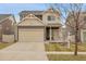 Charming two-story home with a two car garage and well-maintained front yard at 4574 Walden St, Denver, CO 80249