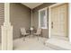 Inviting front porch with seating, perfect for relaxing outdoors at 4574 Walden St, Denver, CO 80249