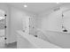 Upstairs hallway features neutral carpeting and white painted doors at 4574 Walden St, Denver, CO 80249