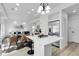 Open floor plan of the kitchen and dining area with stainless steel appliances and modern decor at 4574 Walden St, Denver, CO 80249