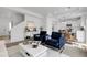Beautiful living room with an open floor plan and modern kitchen view at 4574 Walden St, Denver, CO 80249